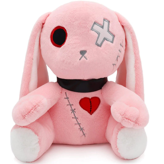 Pink plush toy with a heart and cross on a white background